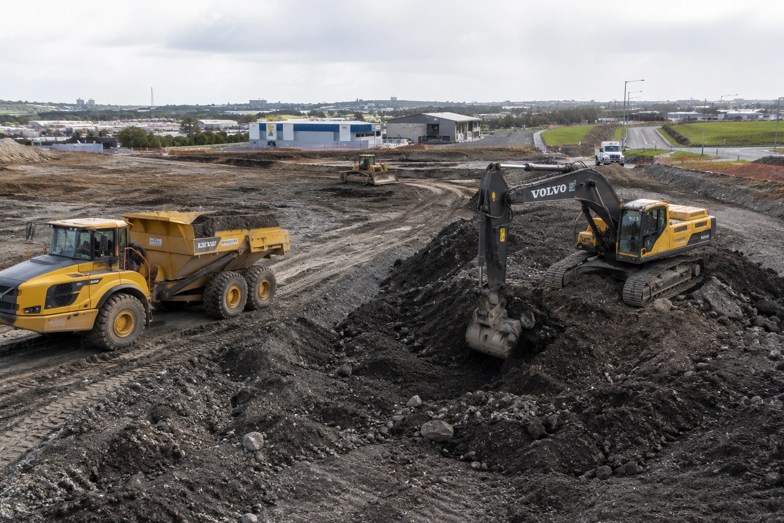 Under House Excavation Auckland 2 Commercial earthworks contractor preparing a commercial construction site in West Auckland with excavators and earthmoving equipment.